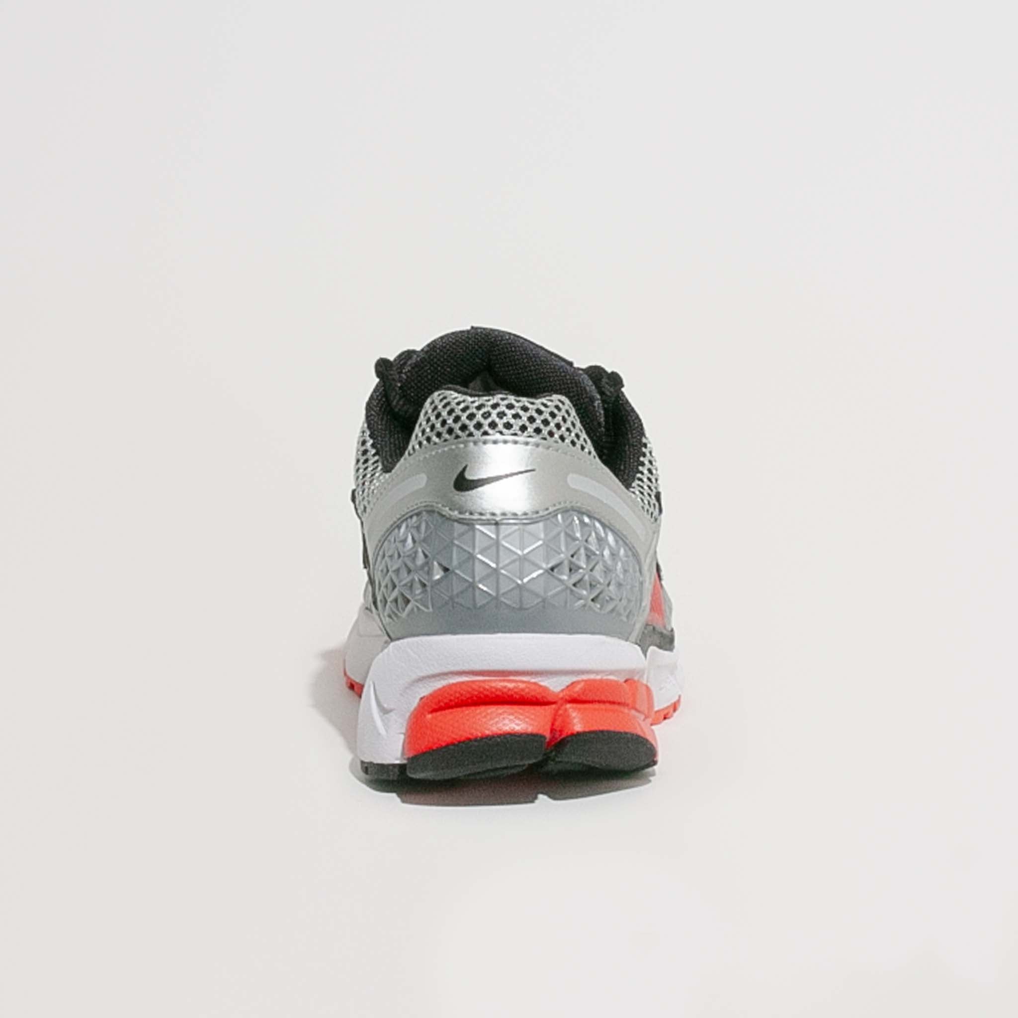 Rear heel view of the Nike Zoom Vomero 5 with geometric heel support detail and visible outsole cushioning.