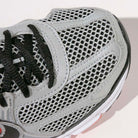 Detailed view of the forefoot mesh and layered paneling on the Nike Zoom Vomero 5 for breathability and structure.